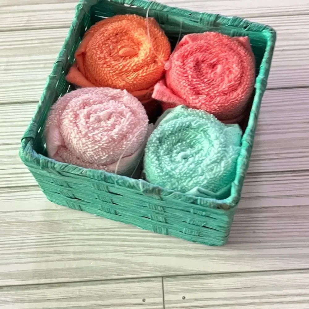 Colorful Rolled Wash Cloths in Basket